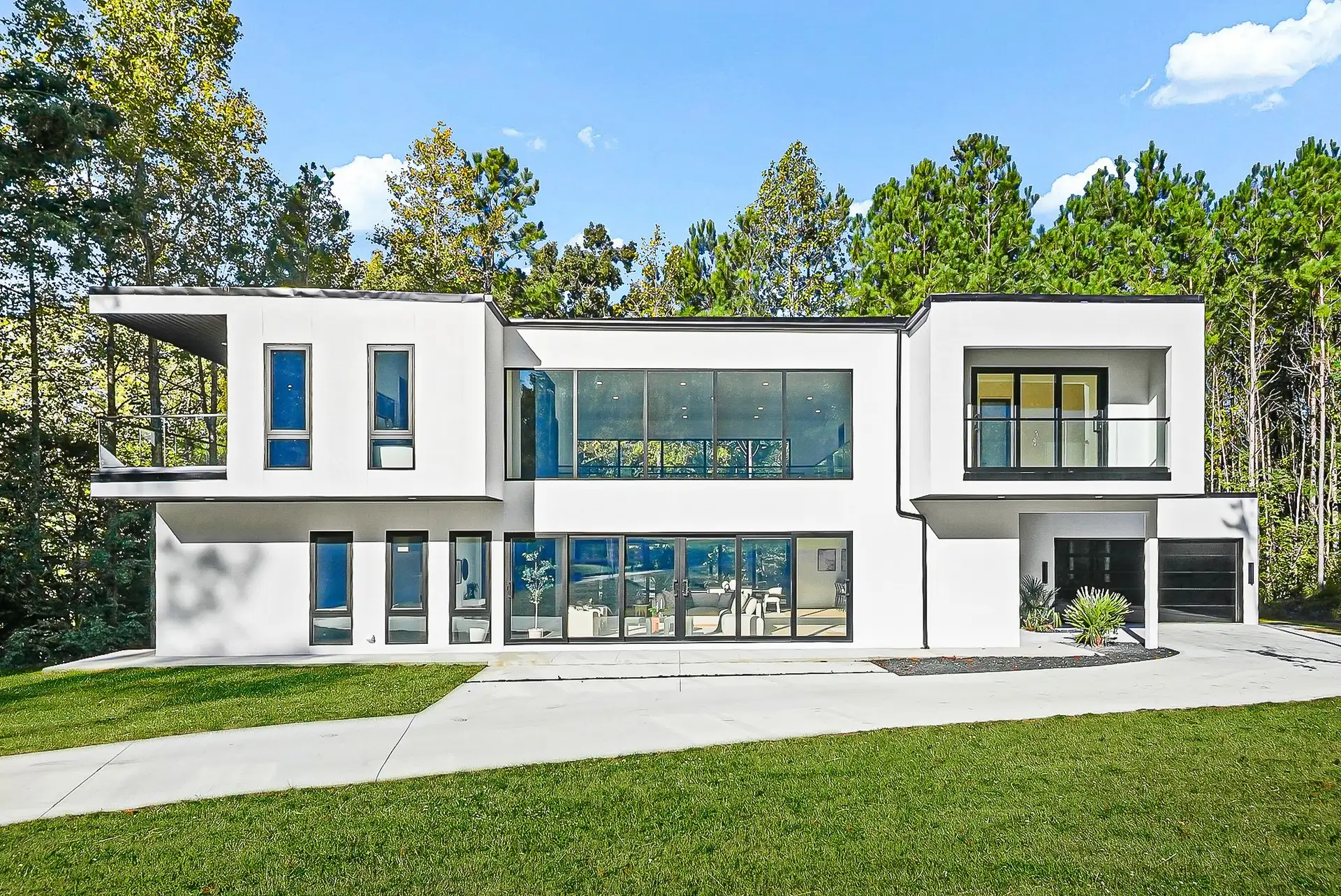 South Fulton Residence, a modern white two-story home by LUDE Capital